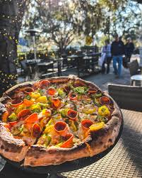 Back Porch Pizza Bar signature dishes Fungool Pizza, Fig Pizza, Nacho Problem.